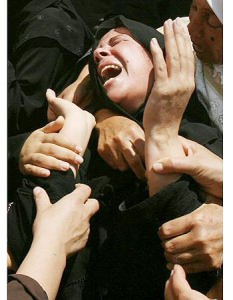 Palestinian relative mourning victims of Gaza beach shelling